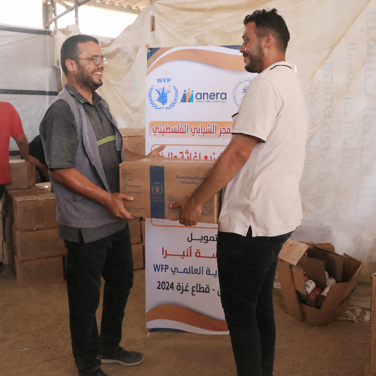 Distribution of WFP Food Parcels in Cooperation with Anera to Displaced Families in Al-Mawasi, Khan Younis.